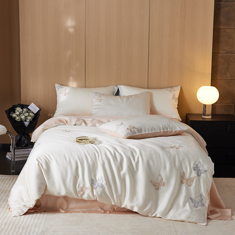 Reversible bedding set made of cotton percale with finely embroidered breakfast motifs