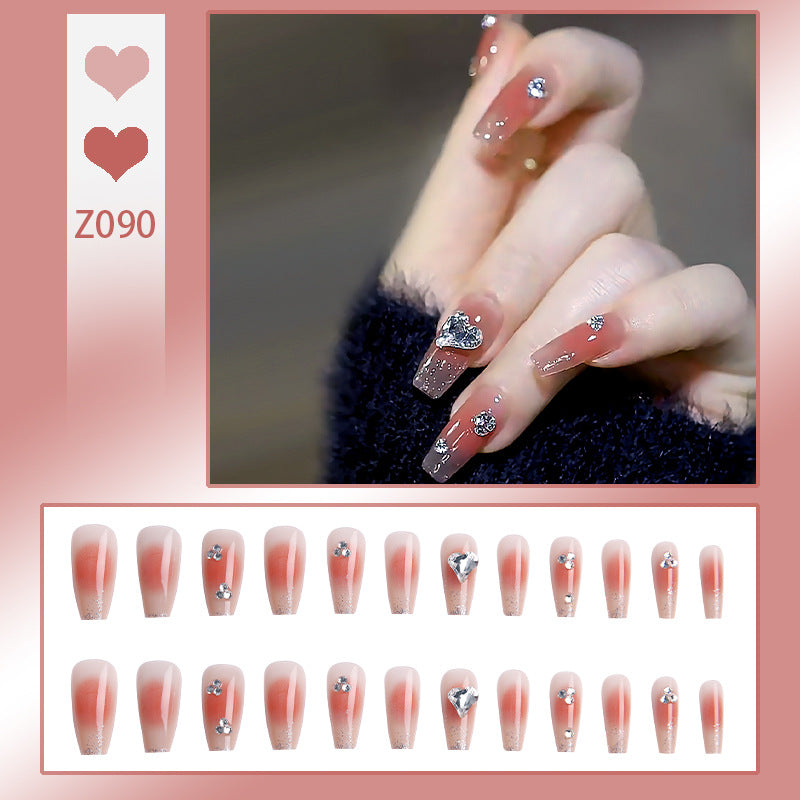 Acrylic nail set with elegant heart and rhinestone decorations Stornfield