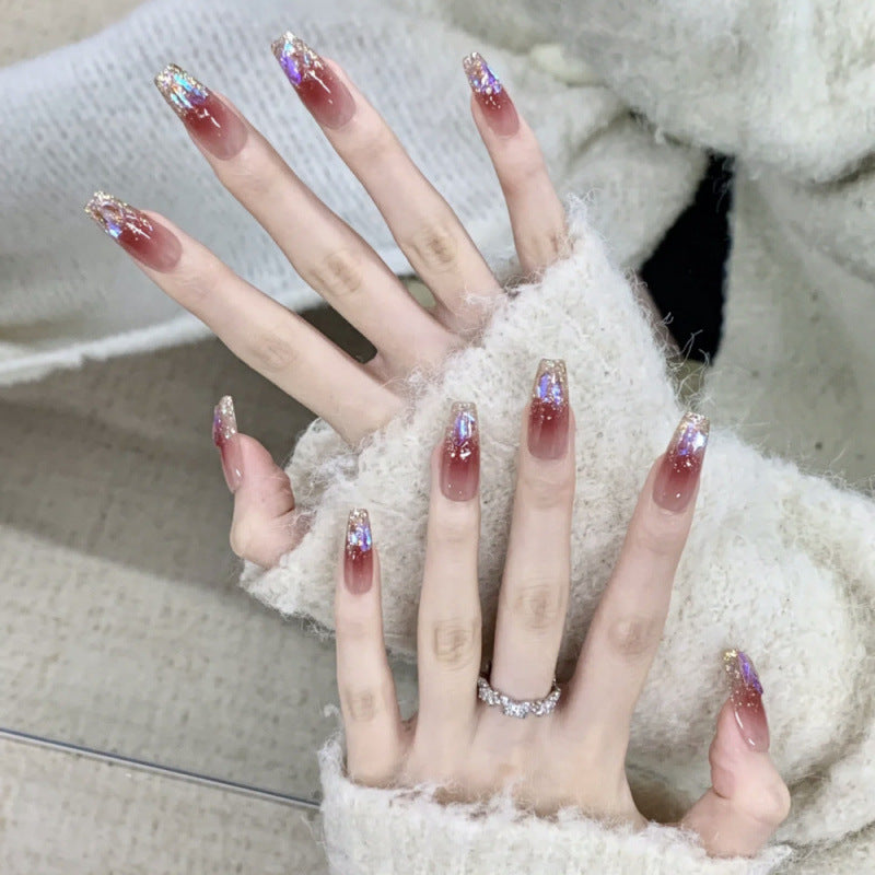 Glamorous artificial nails with glitter effects Stornfield