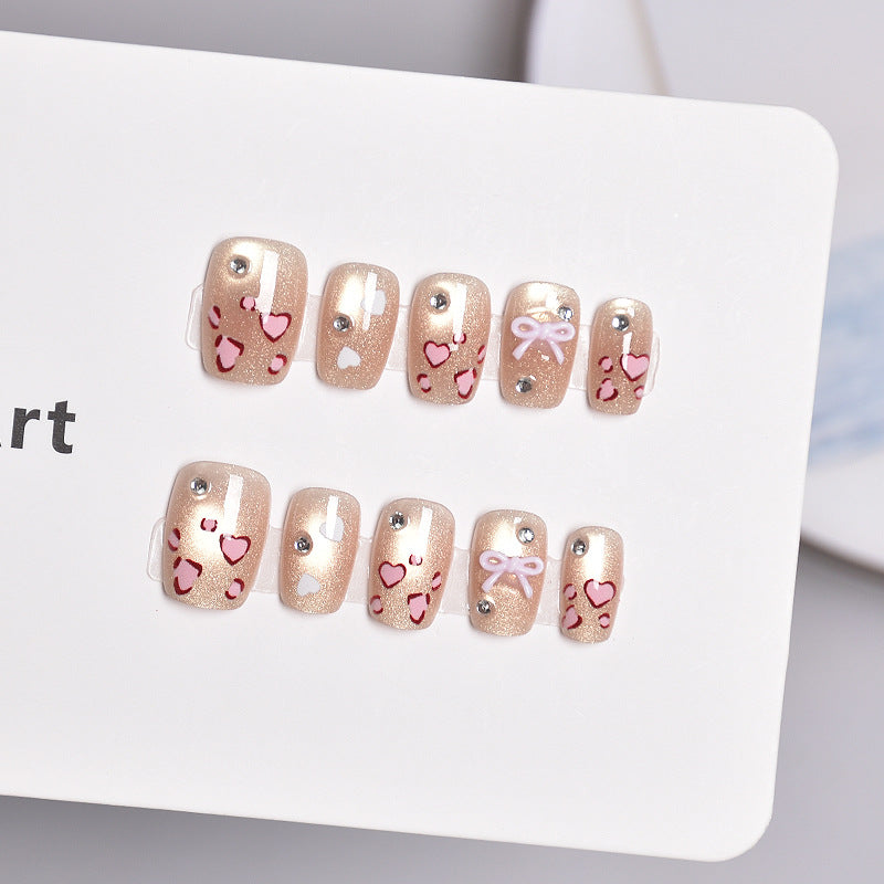 Artistic Press-On Nail Set with Heart and Bow Designs Stornfield