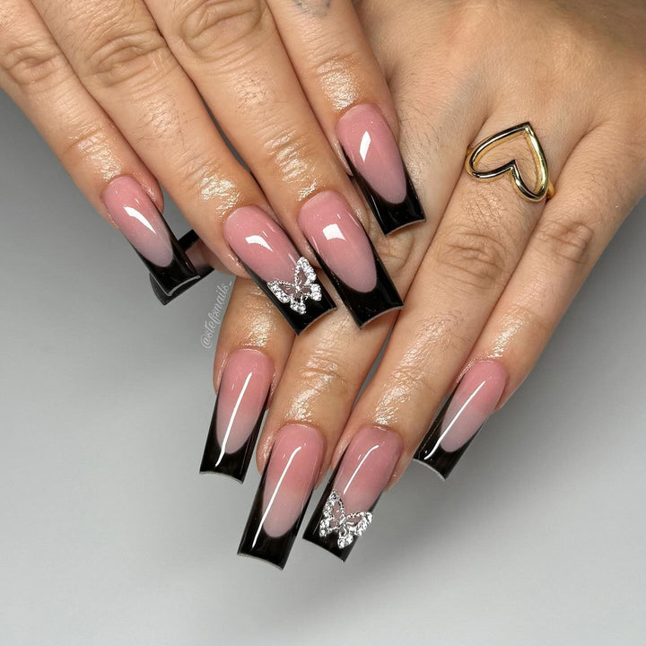 Acrylic nail set with elegant butterfly accents Stornfield
