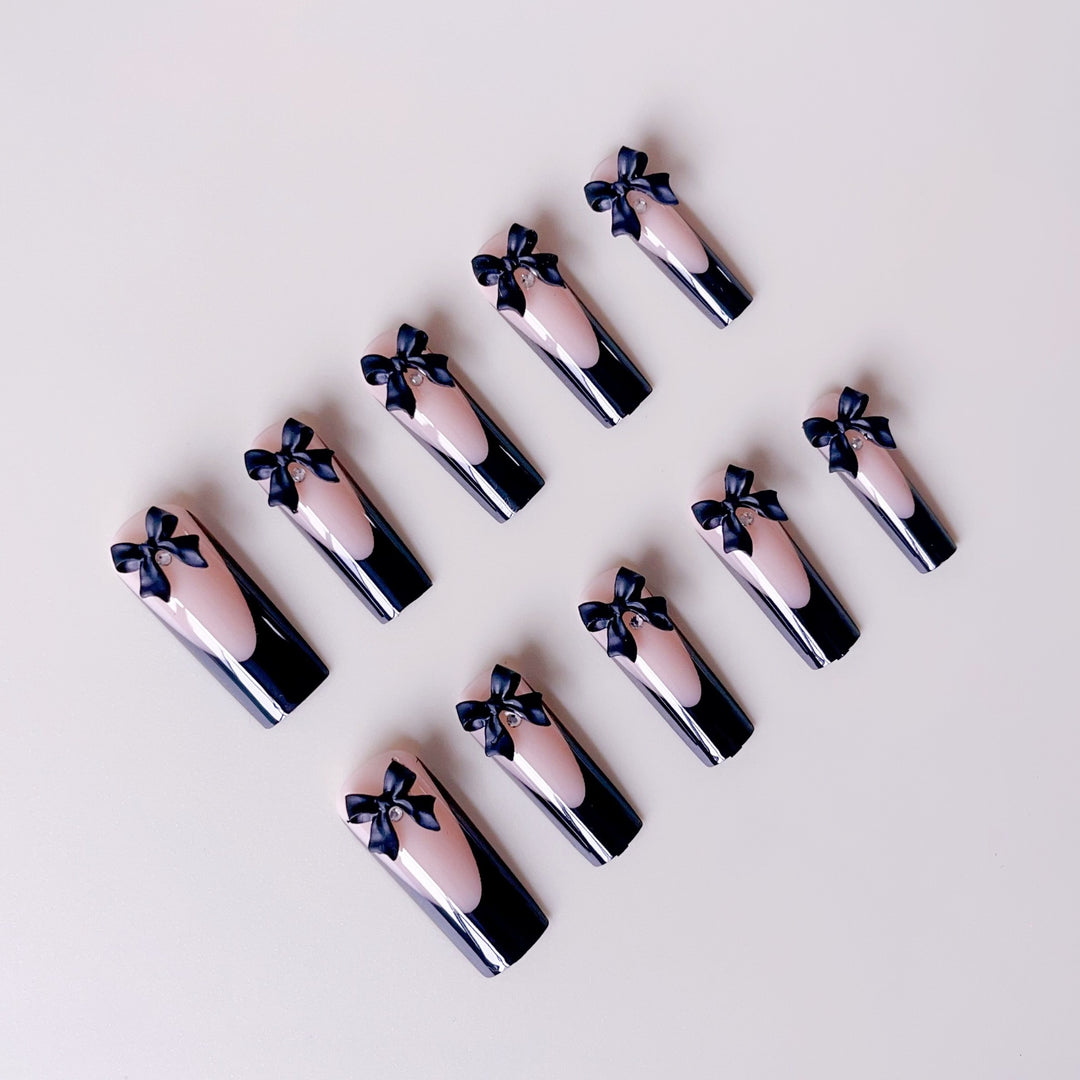 Elegant artificial nail tips with bow decorations Stornfield