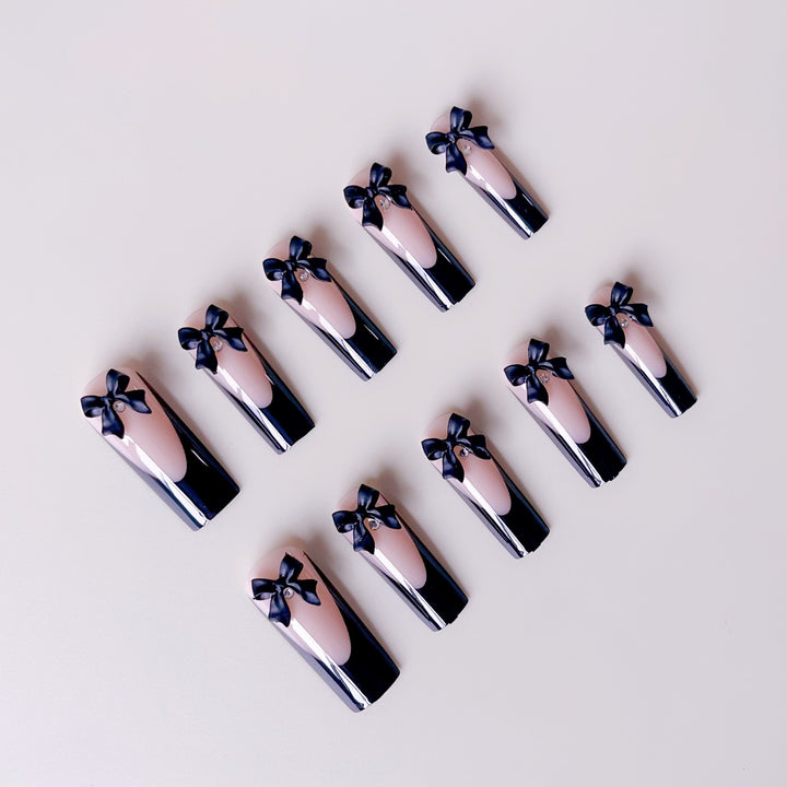 Elegant artificial nail tips with bow decorations Stornfield