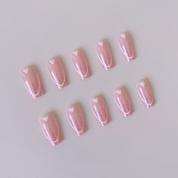 Nail art set with romantic heart designs and glamorous accents Stornfield