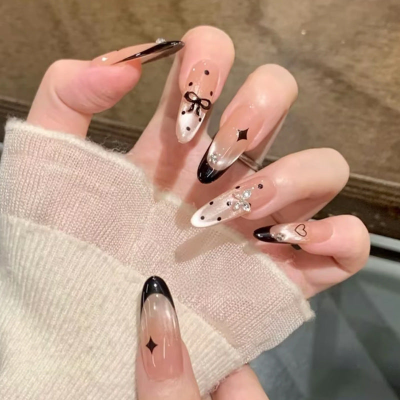Glamorous artificial nails with creative embellishments Stornfield