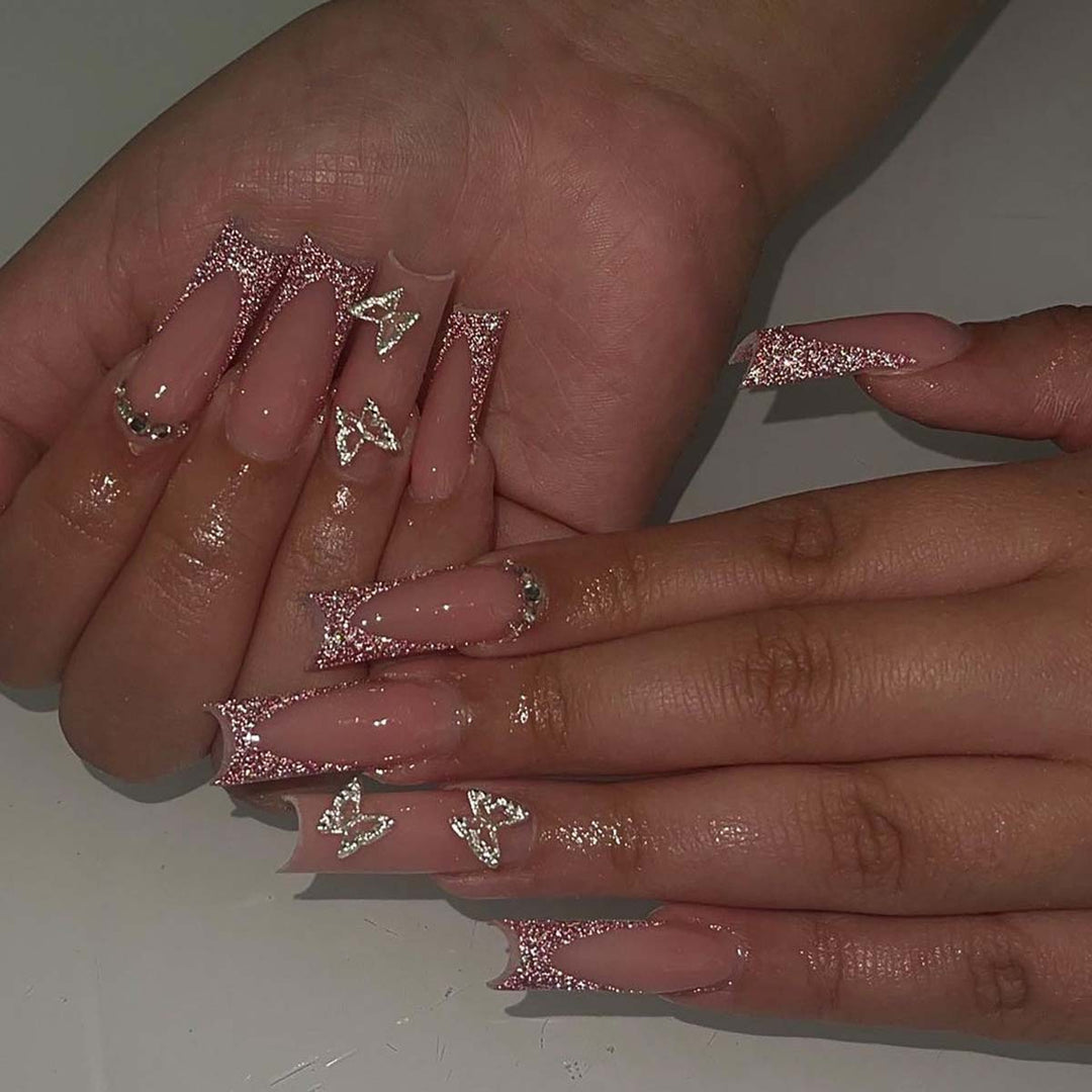 Glamorous stiletto artificial nails with glitter and crystal elements Stornfield