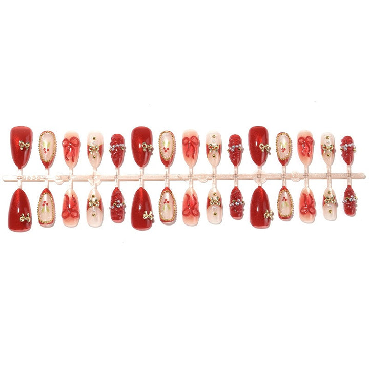 Artificial nail set with glamorous decorations and festive accents Stornfield