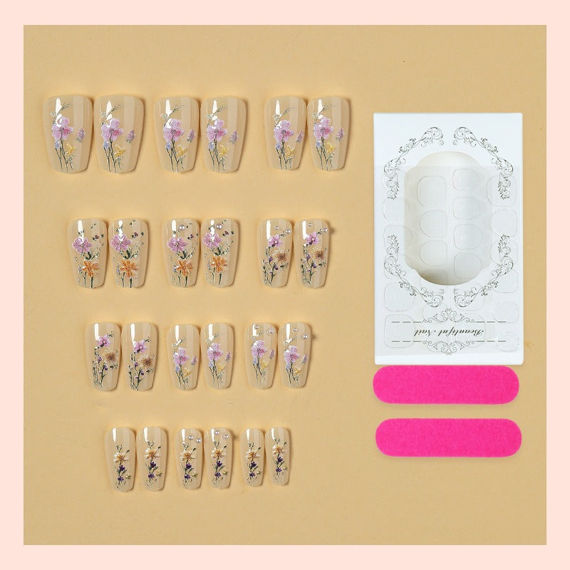 Artificial nail set with floral embellishments and glamorous details Stornfield