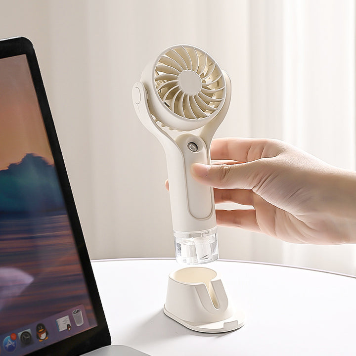 Unisex portable handheld fan with tiltable head, foldable stand and USB charging station Stornfield