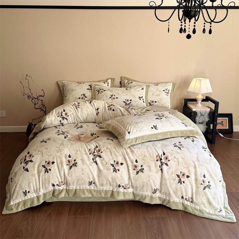 Luxurious quilted bedding set with velvet trim and floral branch motif