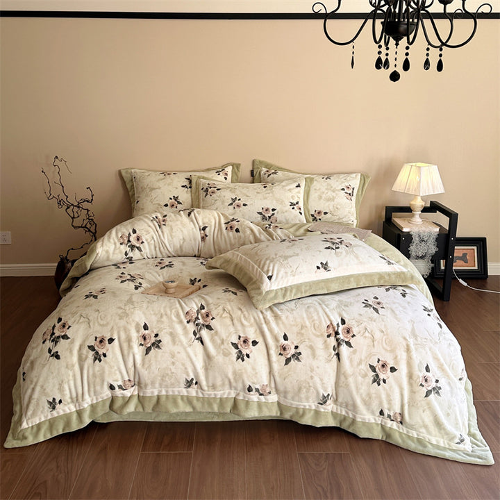 Luxurious quilted bedding set with velvet trim and floral branch motif