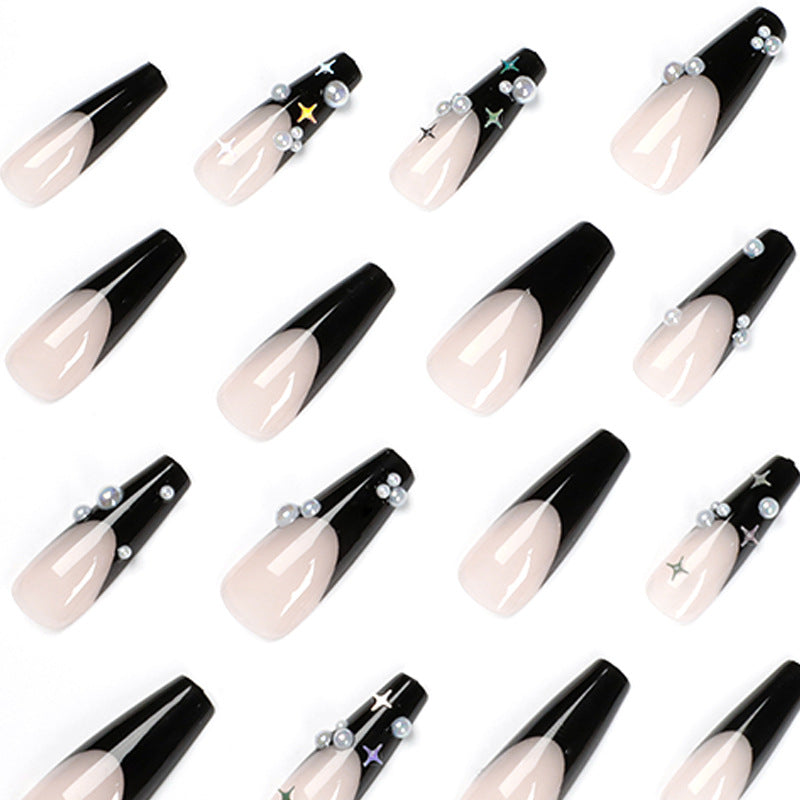 Artificial nail art with pearl and shine elements Stornfield