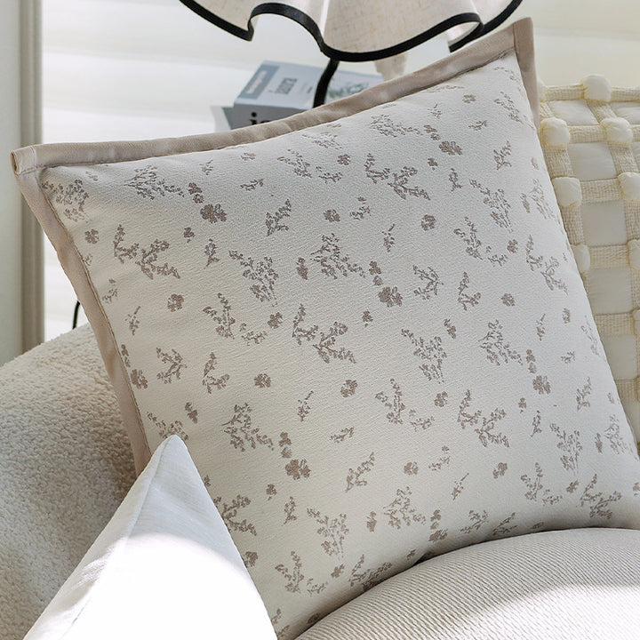 Square decorative cushion cover with subtle floral jacquard texture and elegant piping Stornfield