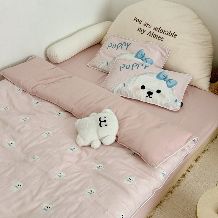 Children's bedding set in futon style with embroidered puppy motifs and cuddle pillow