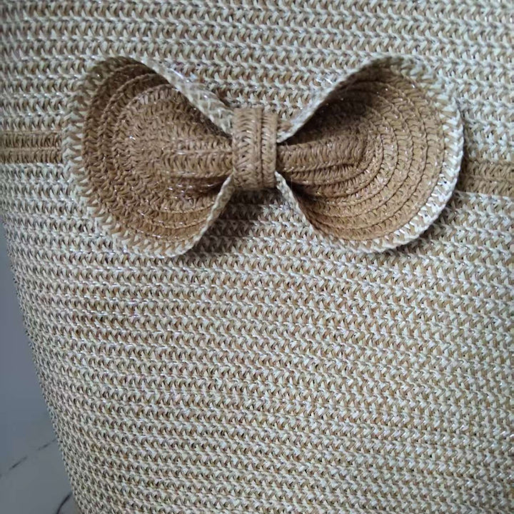 Elegant straw bag with decorative bow closure Stornfield