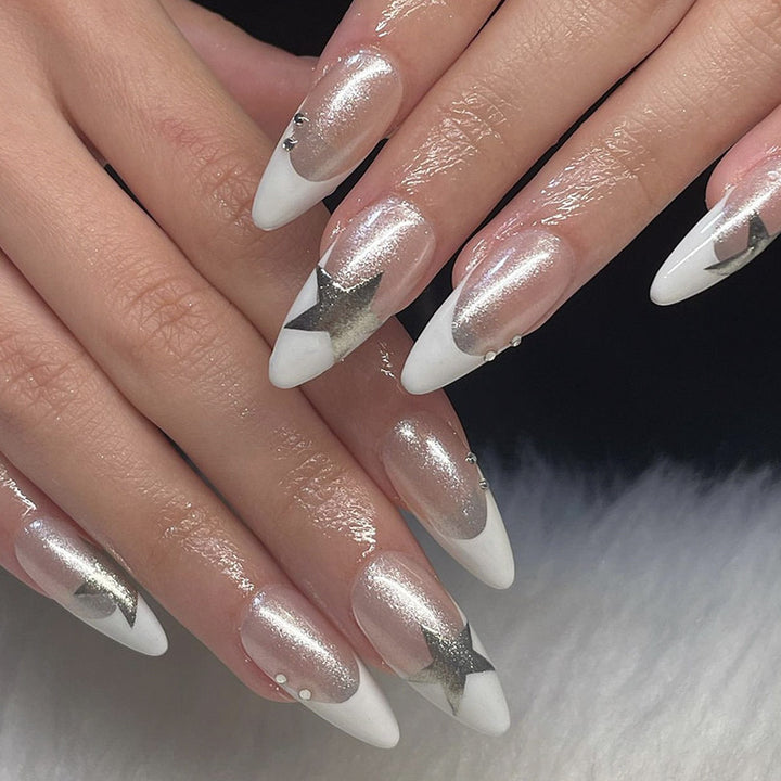 Artful stiletto nails with glitter and star motifs Stornfield