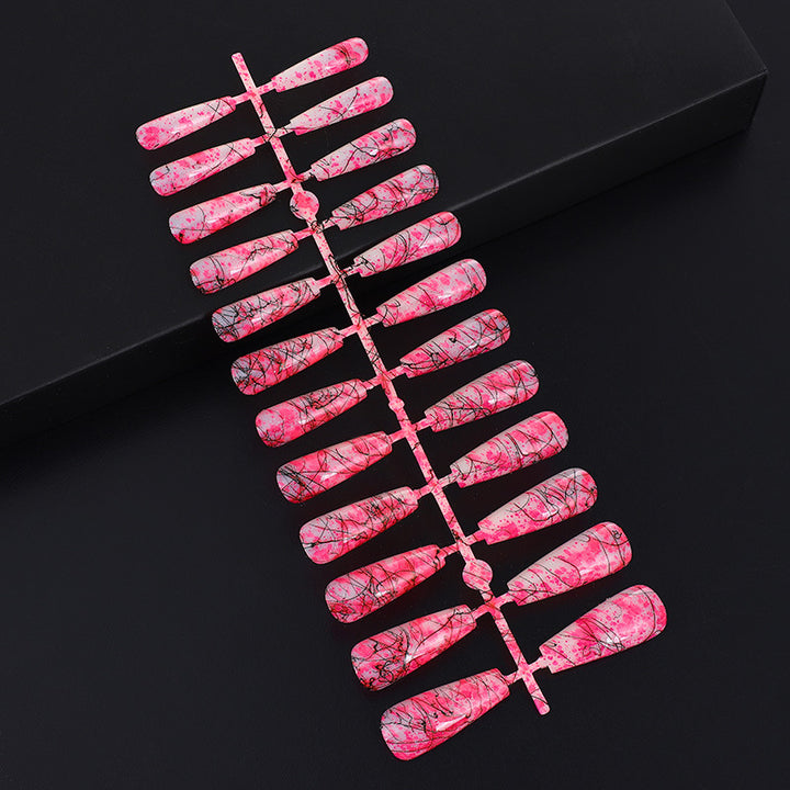 Creative nail art with blood splatter design Stornfield