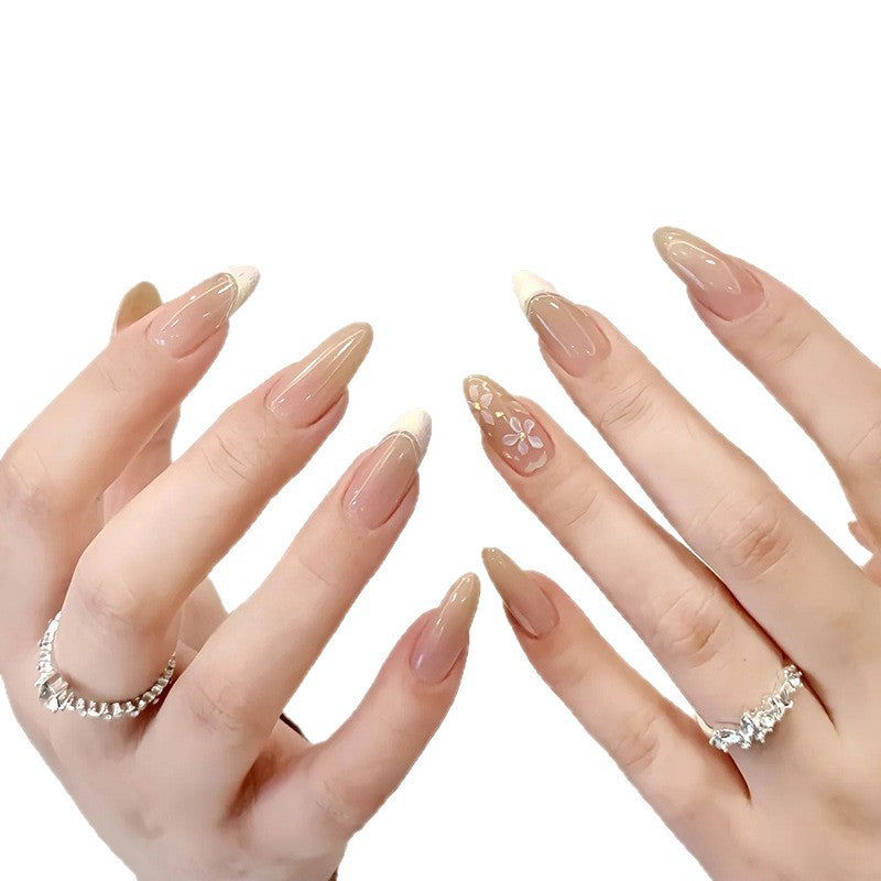 Artificial nails with sweet animal motifs and elegant French tip design Stornfield