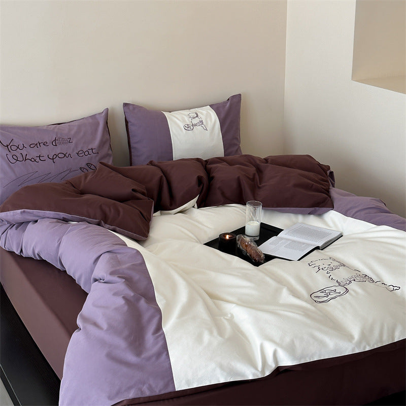 Reversible bedding set with contrasting inserts and fine line embroidery