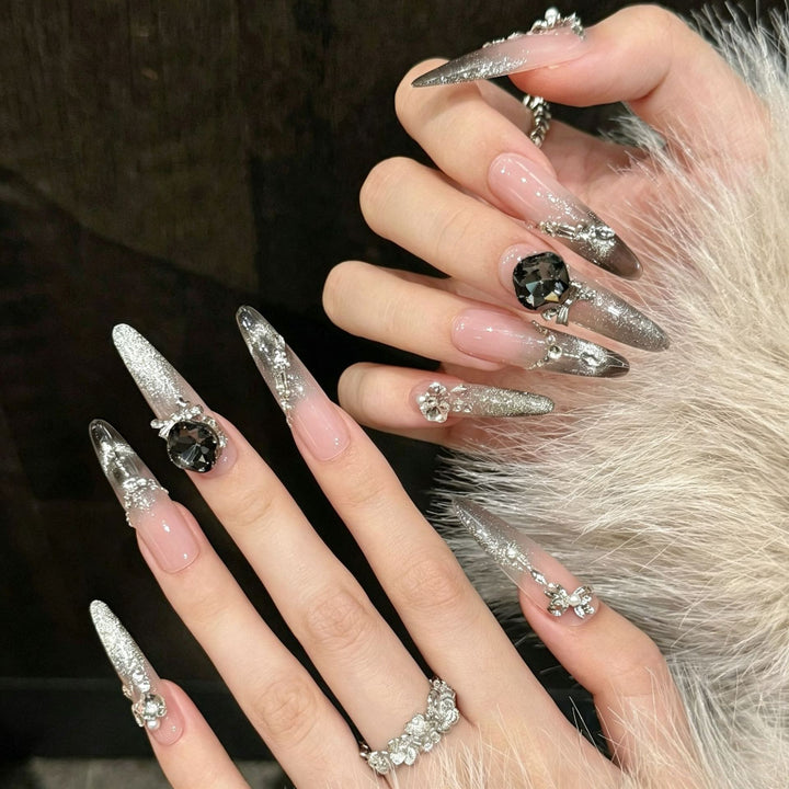Artistic Stiletto Press-On Nail Art with Glimmering Accents Stornfield