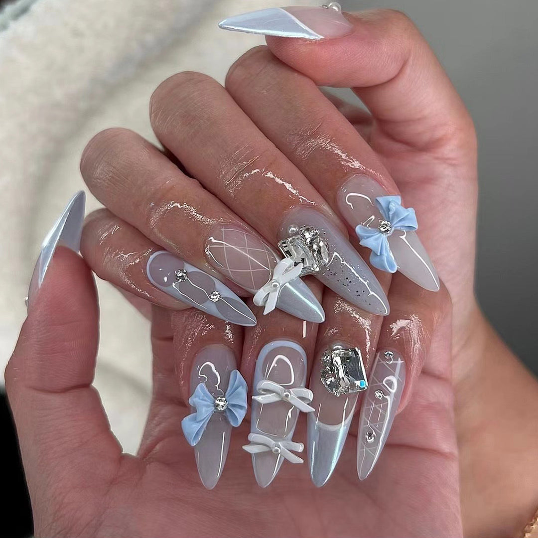 Artistic stiletto nails with elegant jewelry accents Stornfield