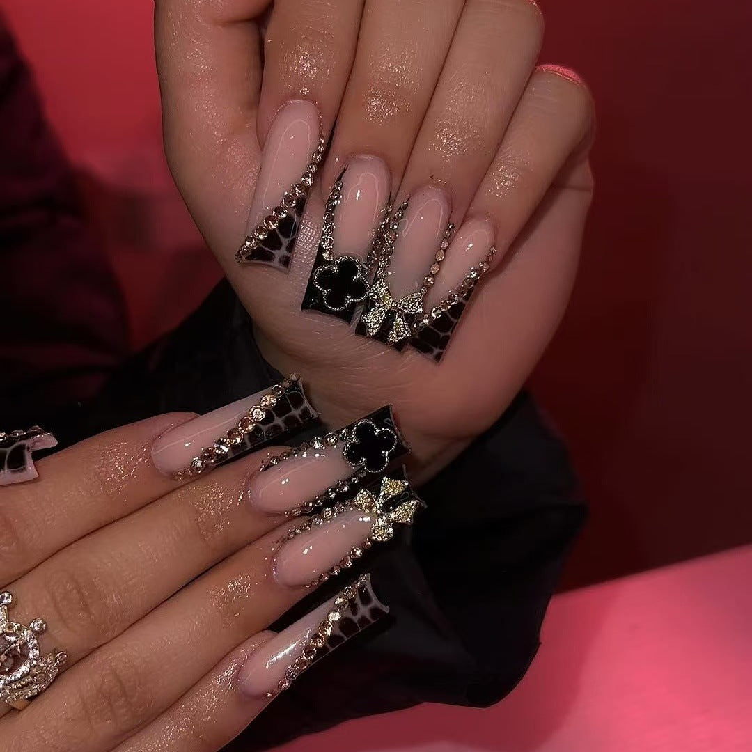 Glamorous artificial nails with elegant design with rhinestones and 3D decorations Stornfield