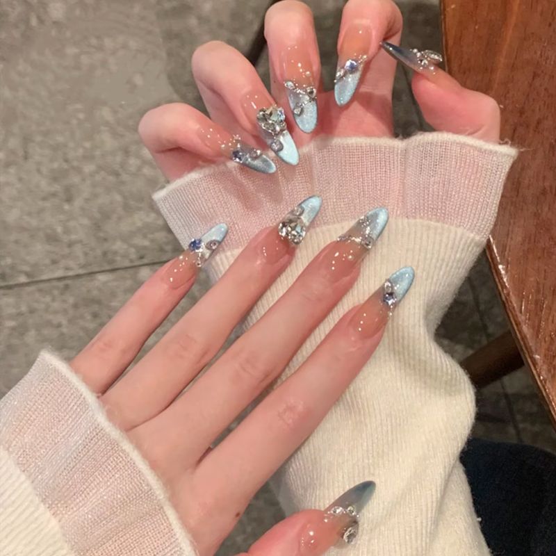 Glamorous artificial nail tips with elegant decorations Stornfield