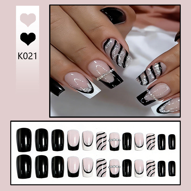 Elegant artificial nails with glitter and stripe accents Stornfield