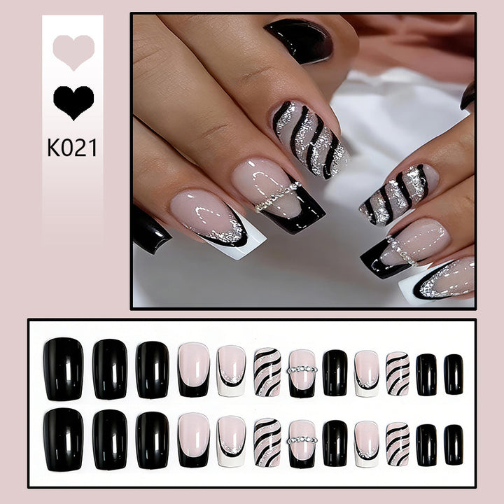 Elegant artificial nails with glitter and stripe accents Stornfield