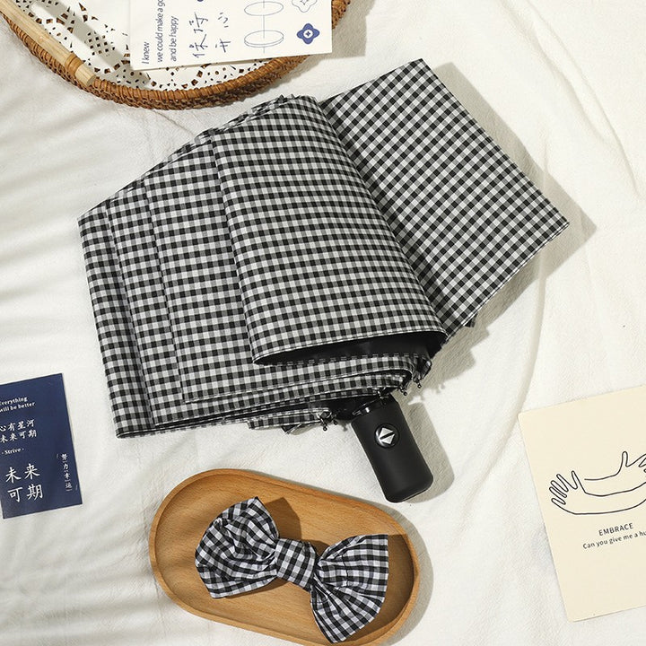 Ladies elegant folding umbrella with classic check pattern Stornfield