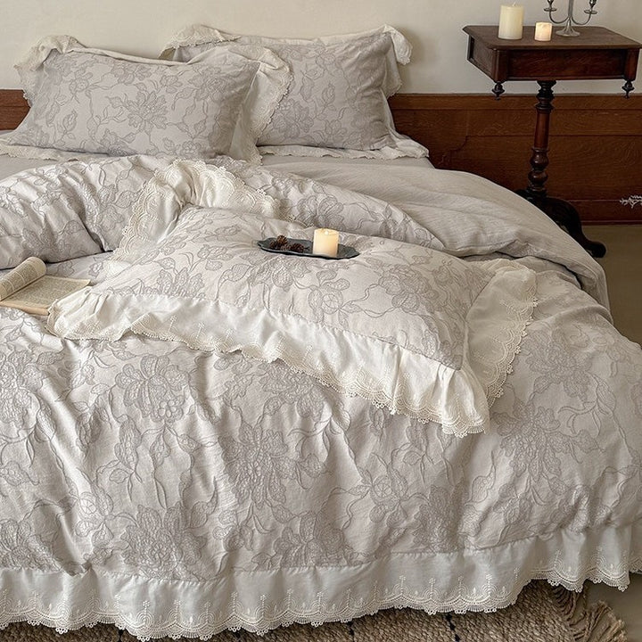 Jacquard bedding set with floral relief pattern and lace border