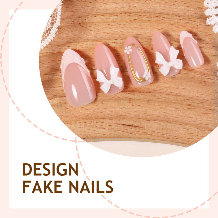 Artificial nail set with playful bow accents and delicate embellishments Stornfield