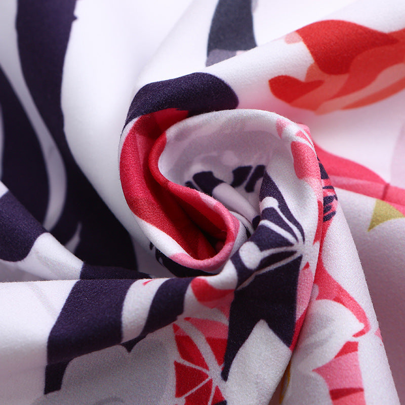 Beach towel with vibrant flamingo motifs and quick-drying material Stornfield