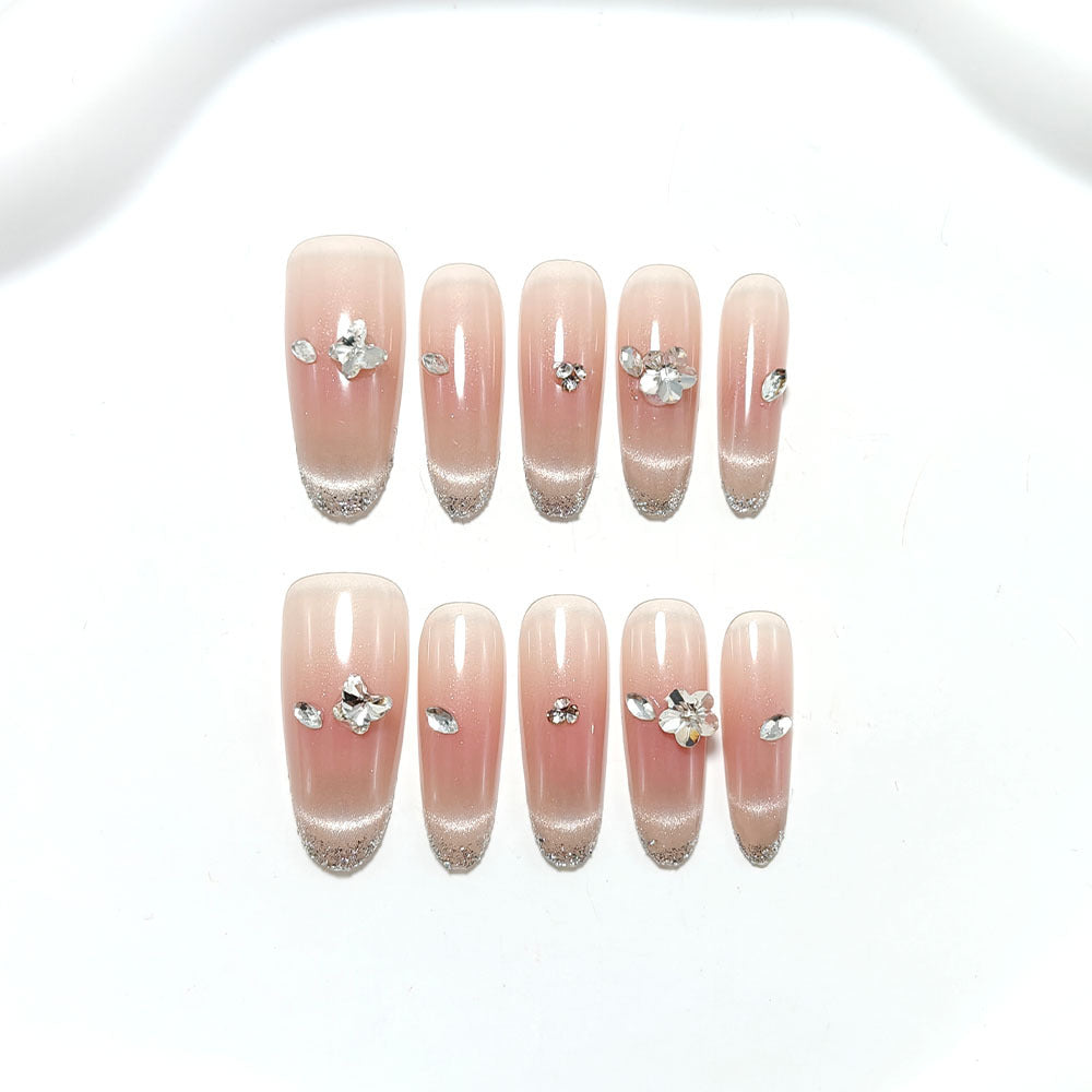 Glamorous artificial nails with rhinestone decorations Stornfield