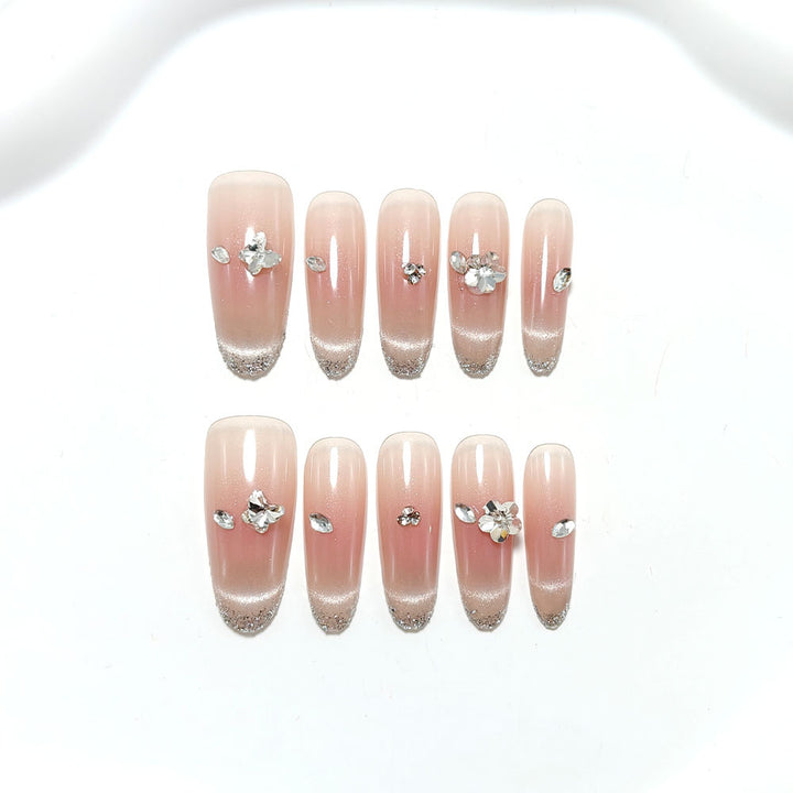Glamorous artificial nails with rhinestone decorations Stornfield