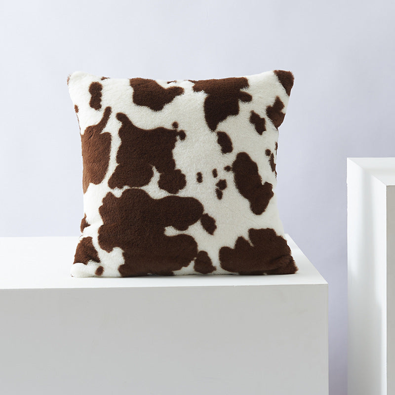 Decorative pillow with cow pattern
