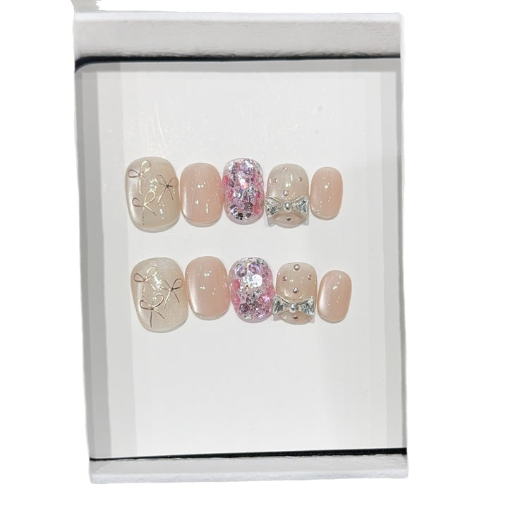 Artificial nails with romantic bow design Stornfield