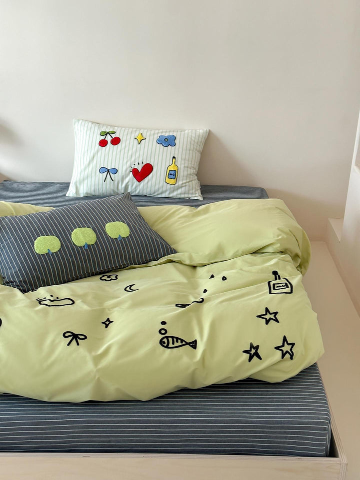 Playful cotton duvet cover set with embroidered motifs and soft fitted sheet