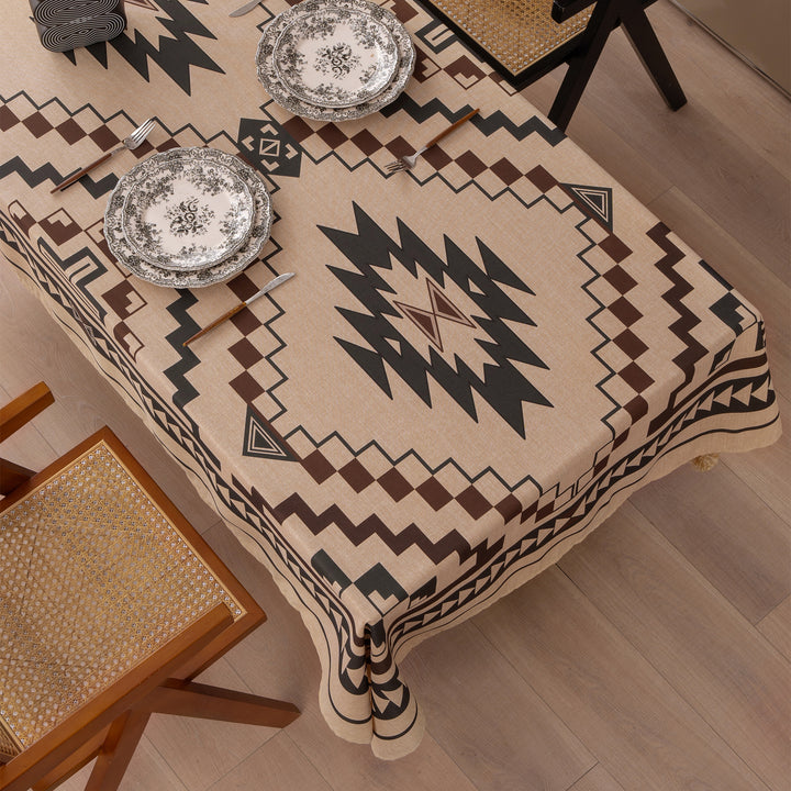 Woven tablecloth with ethnic Aztec pattern and pompom tassels