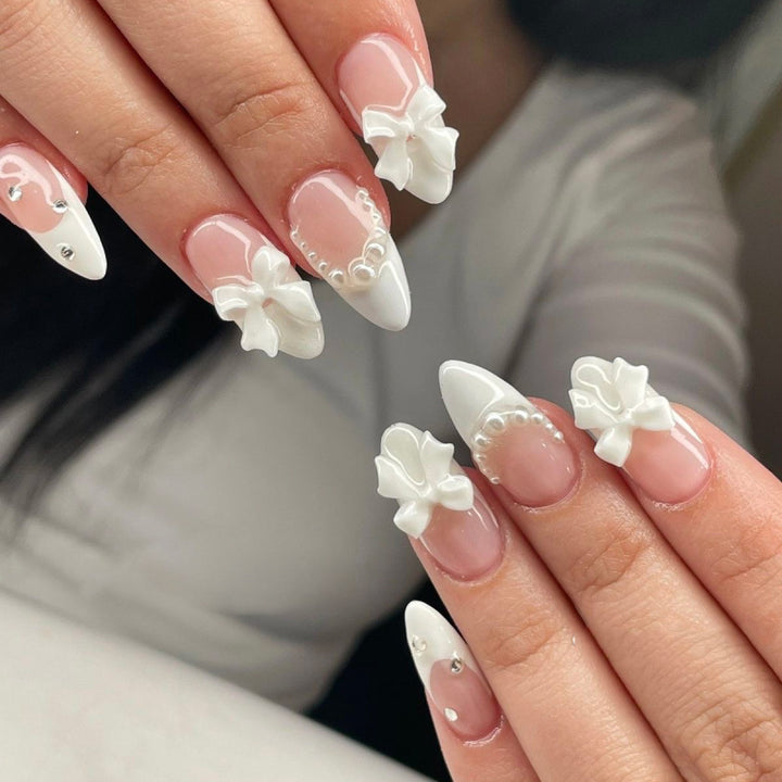 Artful stiletto nails with elegant flower embellishment Stornfield