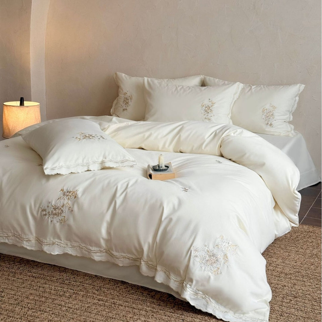 Fine cotton satin bedding set with floral relief embroidery and delicate lace edge