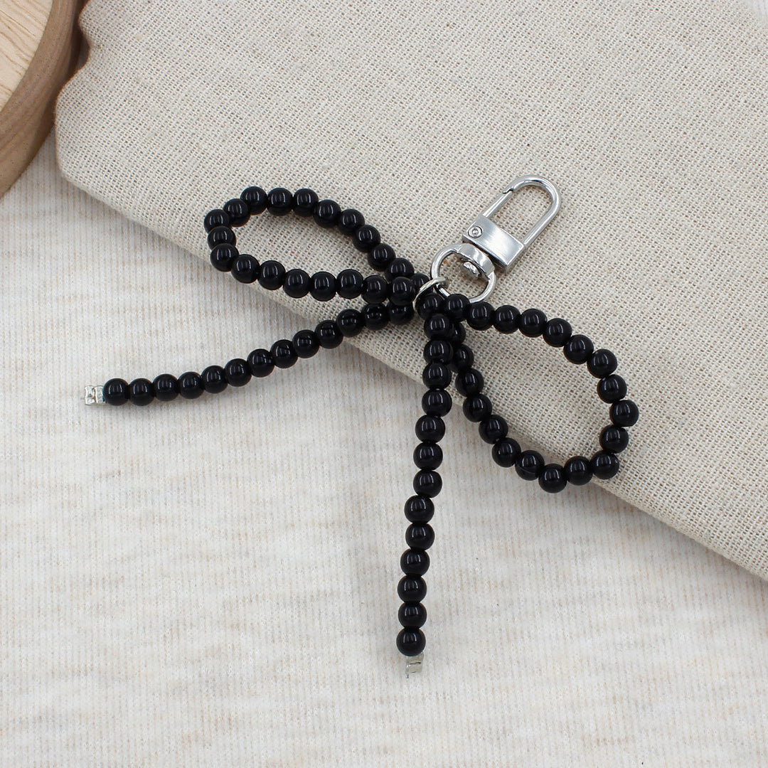 Elegant Pearl Bow Keychain Stornfield