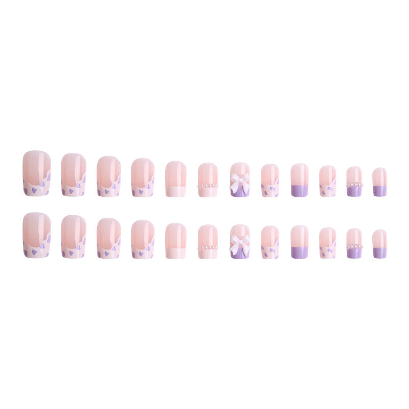 Nail art set with elegant wave patterns and delicate pearl accents Stornfield
