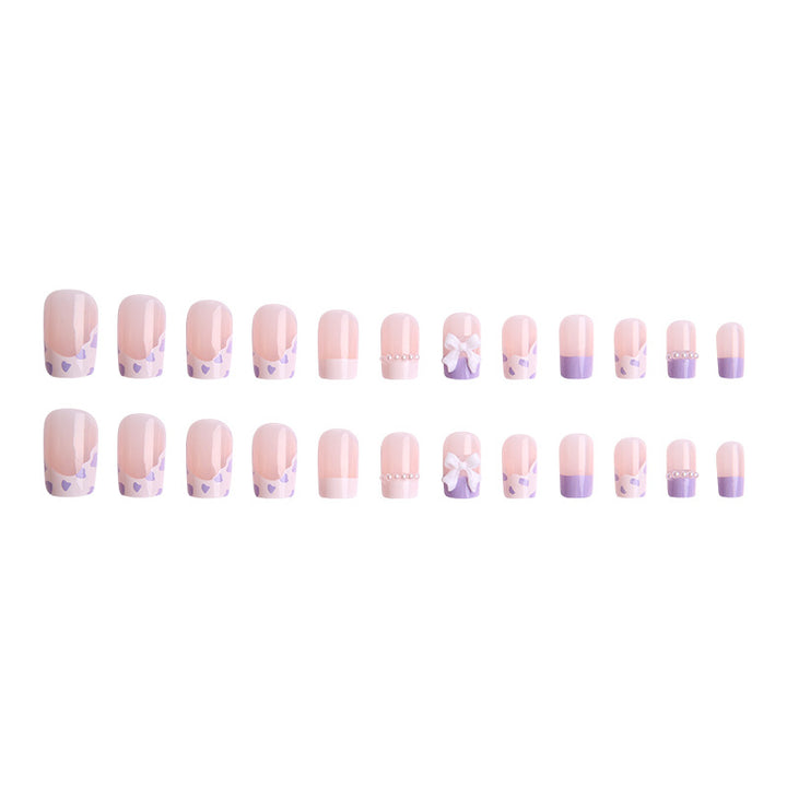 Nail art set with elegant wave patterns and delicate pearl accents Stornfield