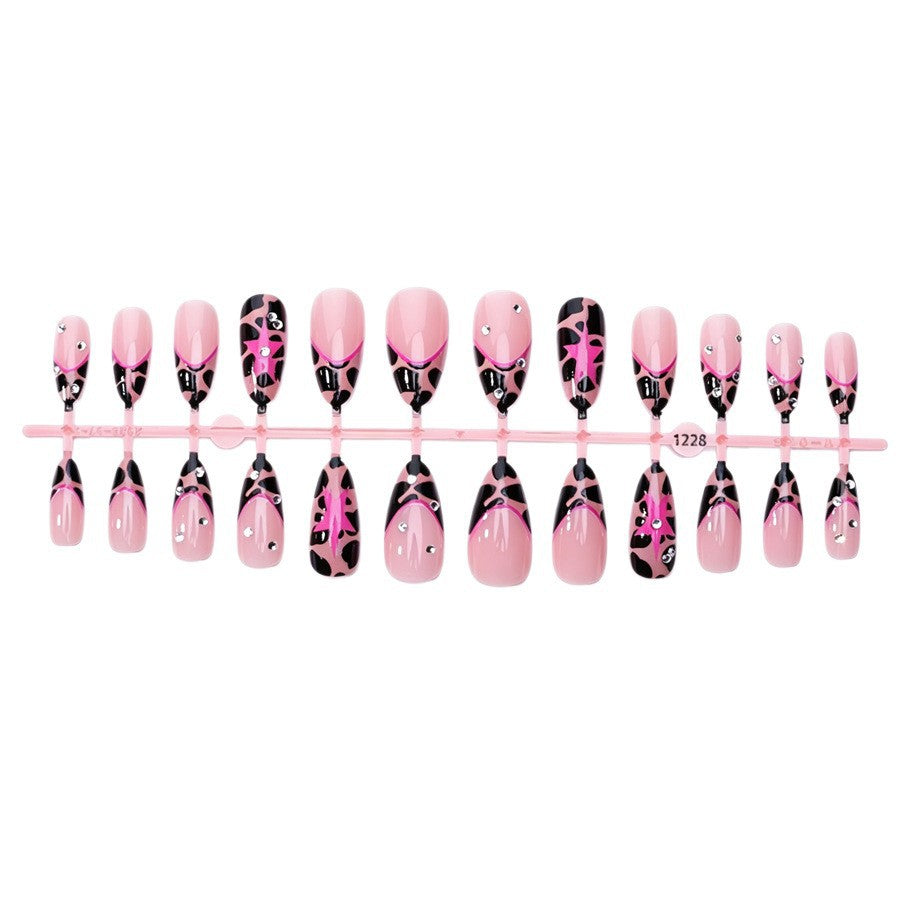Nail set with glamorous leopard design and glitter elements Stornfield