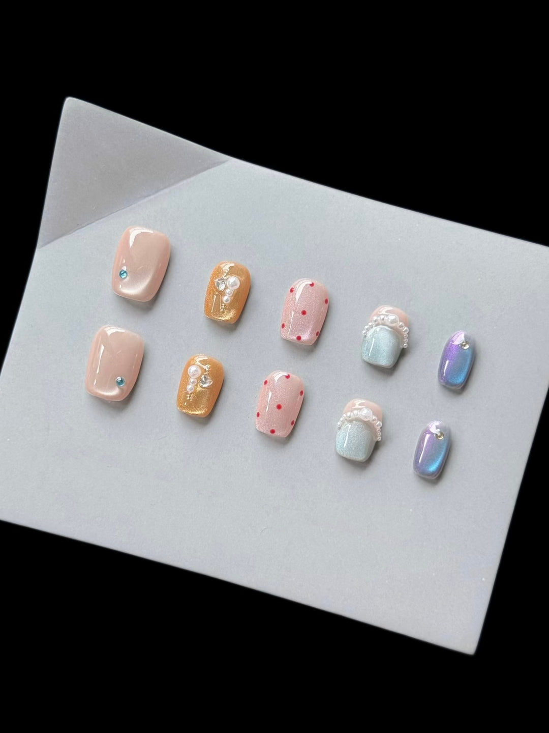 Decorative Press-On Nail Art Set with Unique Gem and Pearl Accents
