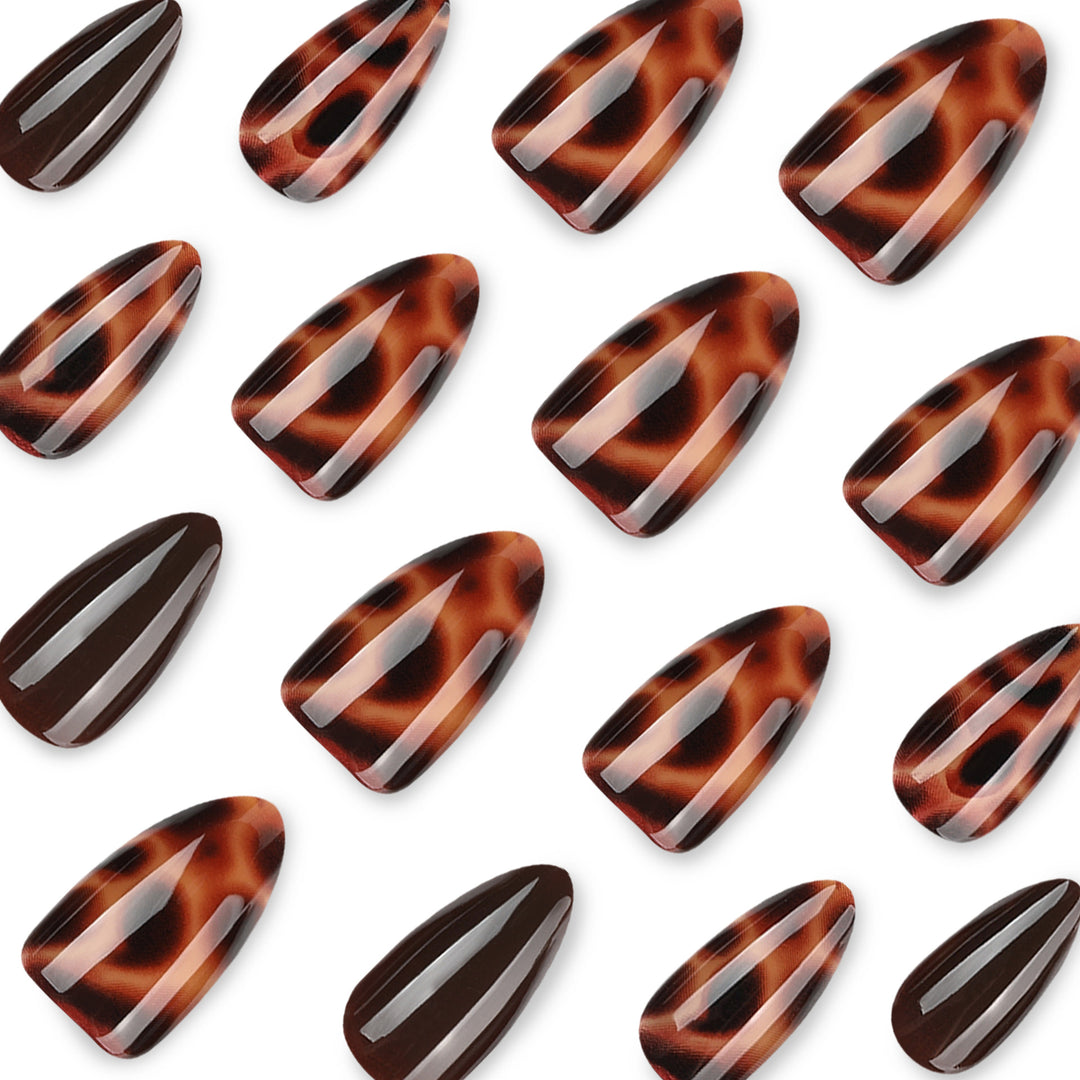 Artful stiletto nails with elegant leopard pattern Stornfield