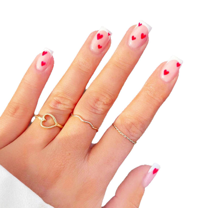 Elegant Heart-Embellished Nail Art Design Stornfield
