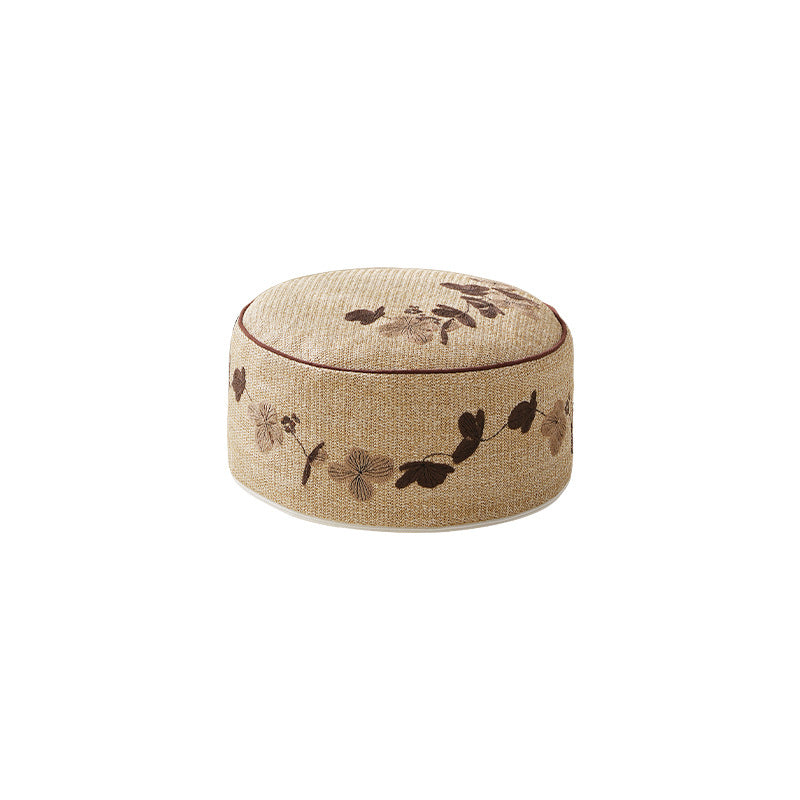 Beef hand-woven pouf with floral print and padded seat surface