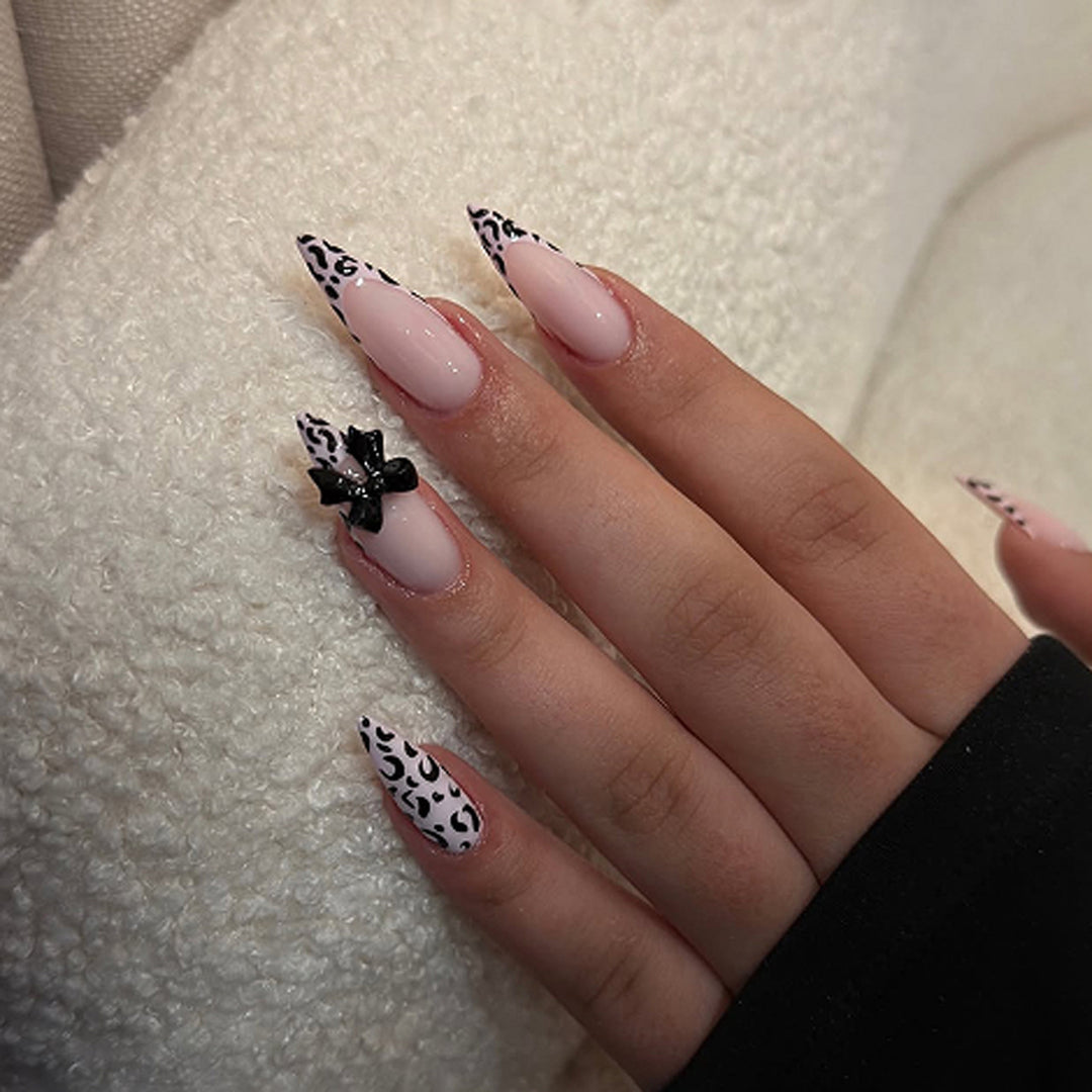 Artful Stiletto Nails with Leopard Print and Bow Accent Stornfield